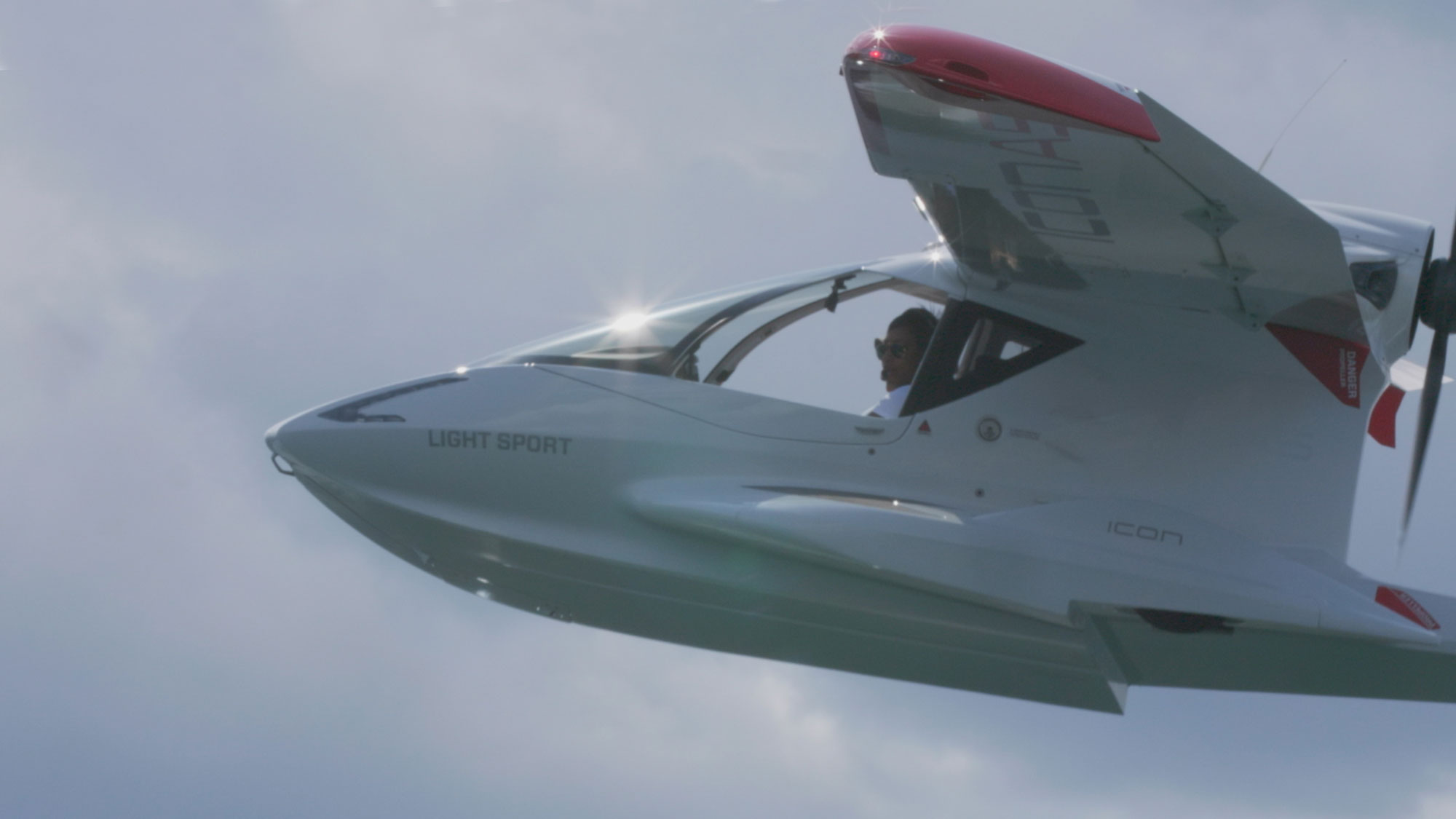 Close up shot of a seaplane flying in the air.