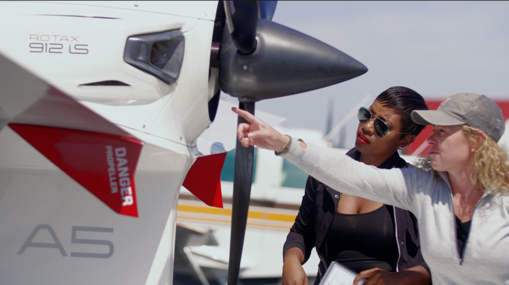 Inspecting the Rotax engine of the ICON A5 seaplane prior to flight.