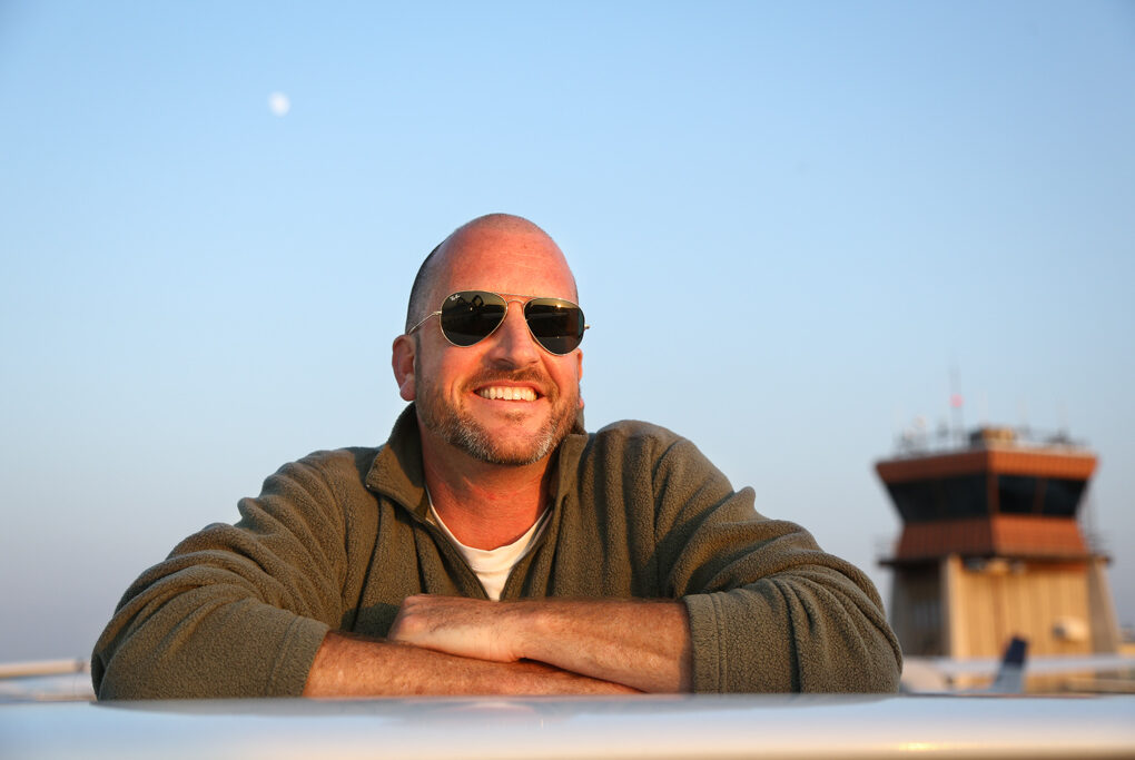 Jason Miller, one of the best known Certified Flight Instructors in general aviation, leaning against an airplane wing.